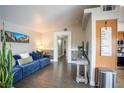 Inviting living room with a comfortable blue couch and stylish decor at 520 Arrowhead Trl # 1322, Henderson, NV 89015