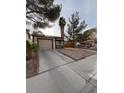 Charming single-Gathering home with a private driveway, desert landscaping, and warm exterior paint at 542 Grimsby Ave, Henderson, NV 89014