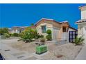 Lovely landscaped front yard with desert landscaping, mature trees, and rock groundcover at 5548 Spearfish Lake Ct, Las Vegas, NV 89148