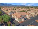 An aerial view showcasing the community's beautiful architecture and landscaping with mountain backdrop at 5855 Valley Dr # 1070, North Las Vegas, NV 89031