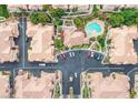 An aerial view showing the community pool and surrounding lush landscape in a well-maintained complex at 5855 Valley Dr # 1070, North Las Vegas, NV 89031