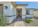 Inviting front entrance with a decorative stone pathway and neutral-toned exterior at 6432 Linden St, North Las Vegas, NV 89086