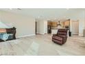 Open-concept living room featuring hardwood floors and a fireplace at 6432 Linden St, North Las Vegas, NV 89086