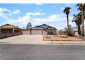 Inviting single-Gathering home with a large driveway and desert landscaping at 806 Fireweed Dr, Henderson, NV 89002