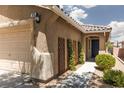 Inviting home exterior with well-maintained landscaping, accentuating a cozy and welcoming entrance at 820 Bernini St, Las Vegas, NV 89144