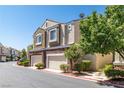 Community offers a townhome and brick exterior design and attached garages at 939 Paisley St, Las Vegas, NV 89145