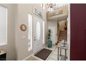 Entryway features an open floorplan with stairs and natural light from the windows at 939 Paisley St, Las Vegas, NV 89145
