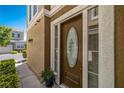 Home features a front door with decorative glass and elegant accents at 939 Paisley St, Las Vegas, NV 89145