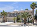 Two-story home with a three car garage and desert landscaping at 9585 Teton Diablo Ave, Las Vegas, NV 89117