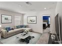 Cozy living room with stylish sectional and decorative accents at 9886 Alpine Style Dr, Las Vegas, NV 89166