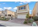 Charming two-story home featuring a two-car garage, desert landscaping, and elegant architectural details at 1556 Olivia Pkwy, Henderson, NV 89011