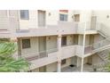 Condo building featuring a well-maintained exterior with walkways and stairs at 2040 Mesquite Ln # 203, Laughlin, NV 89029