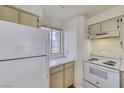 Bright kitchen with essential appliances, including a refrigerator and stove at 2040 Mesquite Ln # 203, Laughlin, NV 89029