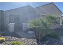 Single-story home featuring desert landscaping, a gated front entry, and a two-car garage at 2048 King Mesa Dr, Henderson, NV 89012
