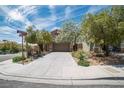 Charming home featuring desert landscaping, a spacious driveway, and a two-car garage at 2529 Flodden St, Henderson, NV 89044