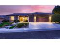 Charming home featuring manicured landscaping, a tile roof, and a spacious three-car garage at 2784 Cherrydale Falls Dr, Henderson, NV 89052