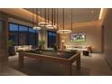 Entertainment area features a stylish pool table, comfortable seating, and a large-screen TV at 400 Rock Peak Dr # 1401, Henderson, NV 89012