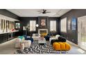 Contemporary living room boasts modern furniture, fireplace, and unique decor at 464 Beardsley Cir, Henderson, NV 89052