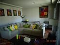 Comfortable living room showcases a sectional sofa, decorative pillows, and stylish artwork at 5889 Thistle Meadow Ave, Las Vegas, NV 89139