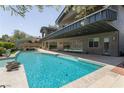Sparkling pool with travertine decking and a covered dining area, perfect for outdoor entertaining at 6 Yorkridge Ct, Henderson, NV 89052