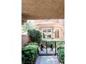 View of decorative wrought iron security gate and walkway leading to the front of the house at 7607 Boca Raton Dr, Las Vegas, NV 89113
