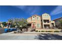 Inviting two-story home featuring a landscaped yard and convenient street parking at 7704 Classy Cashmere Ct, Las Vegas, NV 89149