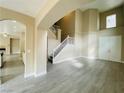 Open-concept living room with high ceilings and hardwood floors at 9821 Sedona Shrine Ave, Las Vegas, NV 89148