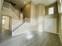 Bright living room with hardwood floors and a staircase at 9821 Sedona Shrine Ave, Las Vegas, NV 89148