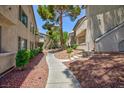 Community pathway lined with mature trees and well-maintained landscaping at , Las Vegas, NV 89120