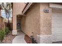 Exterior shot of the front door and entryway displaying the house number at 11029 Meadow Leaf Ave, Las Vegas, NV 89144