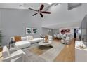 Bright living room with vaulted ceilings, plush seating, and abundant natural light at 1190 E Carson Ave, Las Vegas, NV 89101