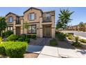 Charming two-story home featuring a well-maintained lawn, beautiful landscaping, and an inviting entryway at 1200 Mission View Ct, Henderson, NV 89002