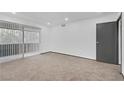Spacious and bright bedroom with neutral carpet, a large window, and ample space for personalization at 1390 Vegas Valley Dr # 26, Las Vegas, NV 89169