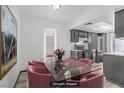 Chic dining area with a glass-top table, stylish chairs, and an open view to the modern kitchen at 1390 Vegas Valley Dr # 26, Las Vegas, NV 89169