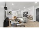 Bright living room showcasing modern decor, a comfortable sofa, and seamless access to the kitchen and patio at 1390 Vegas Valley Dr # 32, Las Vegas, NV 89169