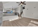 Open concept living room with hardwood flooring and staircase at 1611 Buffalo Trail Dr, Henderson, NV 89014