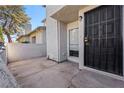 Welcome home to a private patio area leading to the front door with security screen at 1628 Justin Ct # 18, Henderson, NV 89011