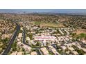 Aerial view of 2090 Eaglepath Cir in a neighborhood featuring tree-lined streets and lush landscaping at 2090 Eaglepath Cir, Henderson, NV 89074