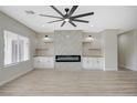 Spacious living room features a modern fireplace, custom built-ins, and a large window for natural light at 2603 Savannah Springs Ave, Henderson, NV 89052