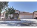 Well-maintained single-story home featuring a tiled roof and inviting curb appeal at 2725 Cool Lilac Ave, Henderson, NV 89052