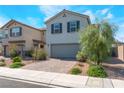 Attractive two-story house featuring a brick driveway, two-car garage, and lovely yard at 2935 Saltillo Ln, Las Vegas, NV 89121