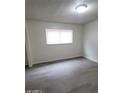 Well-lit bedroom featuring a large window and modern flooring at 304 Orland St # 39, Las Vegas, NV 89107