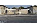 Two-story apartment complex with dual exterior staircases and mature tree at 304 Orland St # 39, Las Vegas, NV 89107