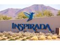 Inspiring community sign with a hummingbird in front of the mountains at 3132 Cartanda Ave, Henderson, NV 89044