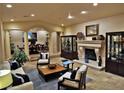 Spacious living area with tile flooring, fireplace, and decorative accents at 5030 Spanish Hills Dr, Las Vegas, NV 89148