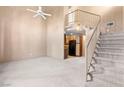 Open floor plan showcases a spacious living area with vaulted ceilings and a view of the kitchen at 5615 Calais Ct, Las Vegas, NV 89118