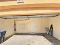 Spacious two-car garage with ample storage space and overhead lighting at 5653 Mount Athos St, North Las Vegas, NV 89031