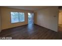View of a brightly lit living room with access to the balcony at 615 S Royal Crest Cir # 10, Las Vegas, NV 89169