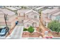 Charming two-story home with a well-maintained front yard and convenient driveway at 6233 Overhang Ave, Henderson, NV 89011