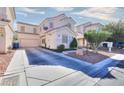 Desirable home showcasing an attached garage and a spacious driveway for easy parking at 6233 Overhang Ave, Henderson, NV 89011